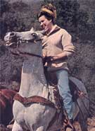 color photo of Jane on a horse